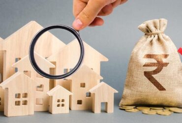 money-bag-with-sign-indian-rupee-rupiah-down-arrow-with-wooden-houses_1048944-13