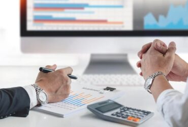 team-business-working-office-discussing-analyzing-graph-chart-business-strategy_