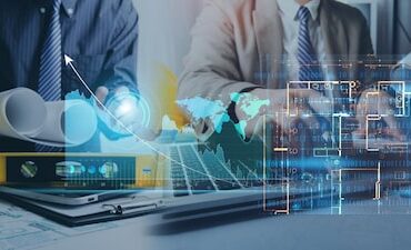 two-colleagues-discussing-data-working-tablet-laptop-with-architectural-project- (1)